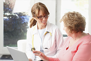 Woman talking with doctor